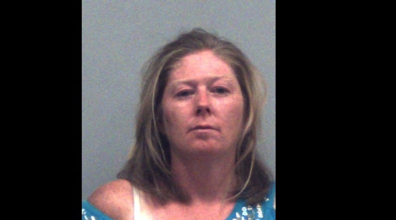 Joy Renee Carter has been charged with aggravated assault and criminal trespass after her boyfriend told police she tried to hit him with a pickax.