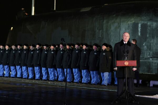 Russian President Vladimir Putin attends a ceremonial ship launching for the nuclear-powered submarine Perm at the Atomflot, a service base for nuclear-powered fleet, in Murmansk, Russia, Thursday, March 27, 2025. (Gavriil Grigorov, Sputnik, Kremlin Pool Photo via AP)