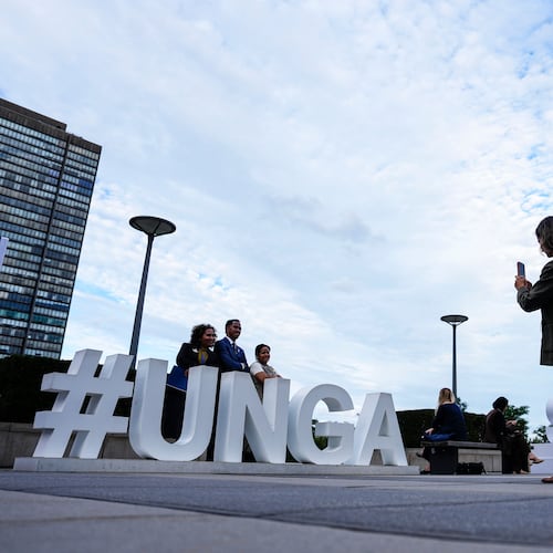 People pose as they arrive for the United Nations General Assembly (UNGA) at the UN headquarters, Monday, Sept. 21, 2026. (Justin Tang/The Canadian Press via AP)