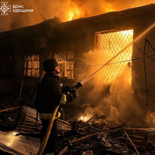 In this photo provided by the Ukrainian Emergency Service, firefighters put out a fire a building following a Russian drone attack in Odesa region, Ukraine, Saturday, May 2, 2026. (Ukrainian Emergency Service via AP)