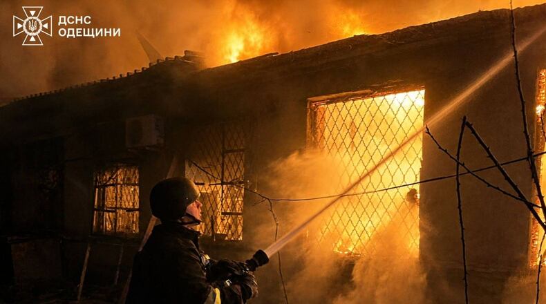 In this photo provided by the Ukrainian Emergency Service, firefighters put out a fire a building following a Russian drone attack in Odesa region, Ukraine, Saturday, May 2, 2026. (Ukrainian Emergency Service via AP)