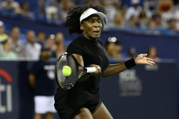 Venus Williams returns the ball against Peyton Stearns during a match at the Citi Open tennis tournament Tuesday, July 22, 2025, in Washington. (AP Photo/Nick Wass)