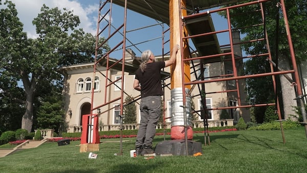 Artist Curtis Ingvoldstad touches up his 20-foot-tall pencil sculpture ahead of its annual sharpening on Wednesday, June 4, 2025 in Minneapolis, Minn. (AP photo/Mark Vancleave)