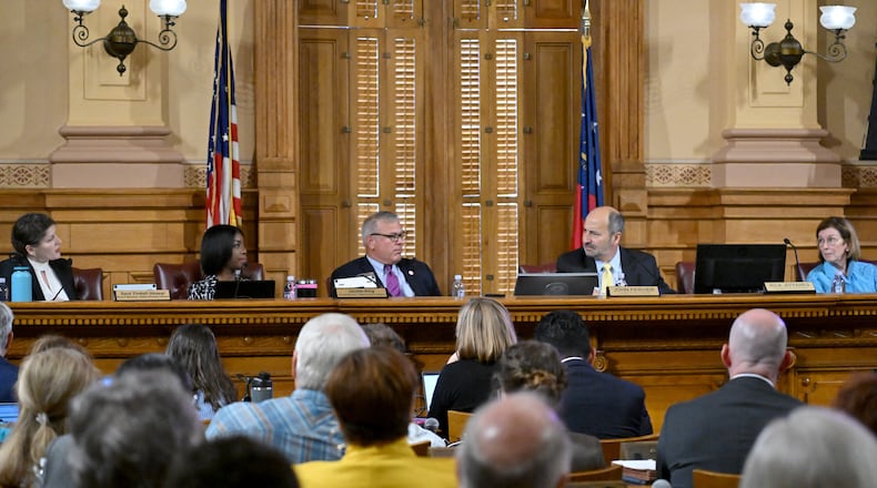 State Election Board Members (from left) Sara Tindall Ghazal, Janelle King, Mike Coan (executive director), John Fervier (chairman) and Janice Johnston are pictured at a meeting at the Capitol in Atlanta on Oct. 8, 2024. (Hyosub Shin / AJC)