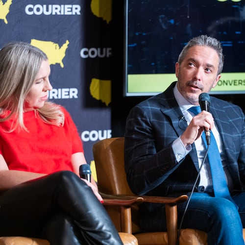 Journalist Brian Beutler and content creator Meredith Lynch speak at a Courier event in December. (Courtesy of
Courier Newsroom)