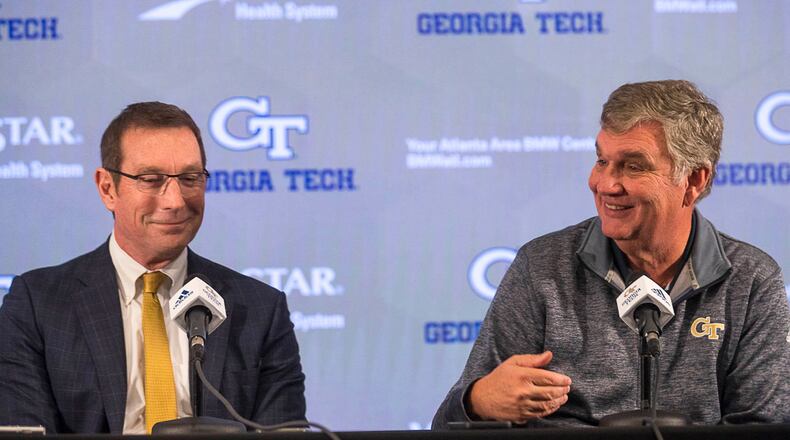 Georgia Tech Athletic Director Todd Stansbury (left) and football head coach Paul Johnson speak during a press conference Thursday, Nov. 29, 2018, in Atlanta addressing Johnson's decision to step down as head coach.