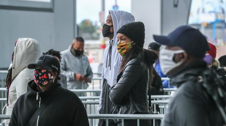 Voters came to State Farm Arena on Monday, Dec. 14, 2020 to cast their votes to determine which political party controls the U.S. Senate on the first day of early voting. Both of Georgia’s Senate seats were up for grabs. (John Spink / John.Spink@ajc.com)