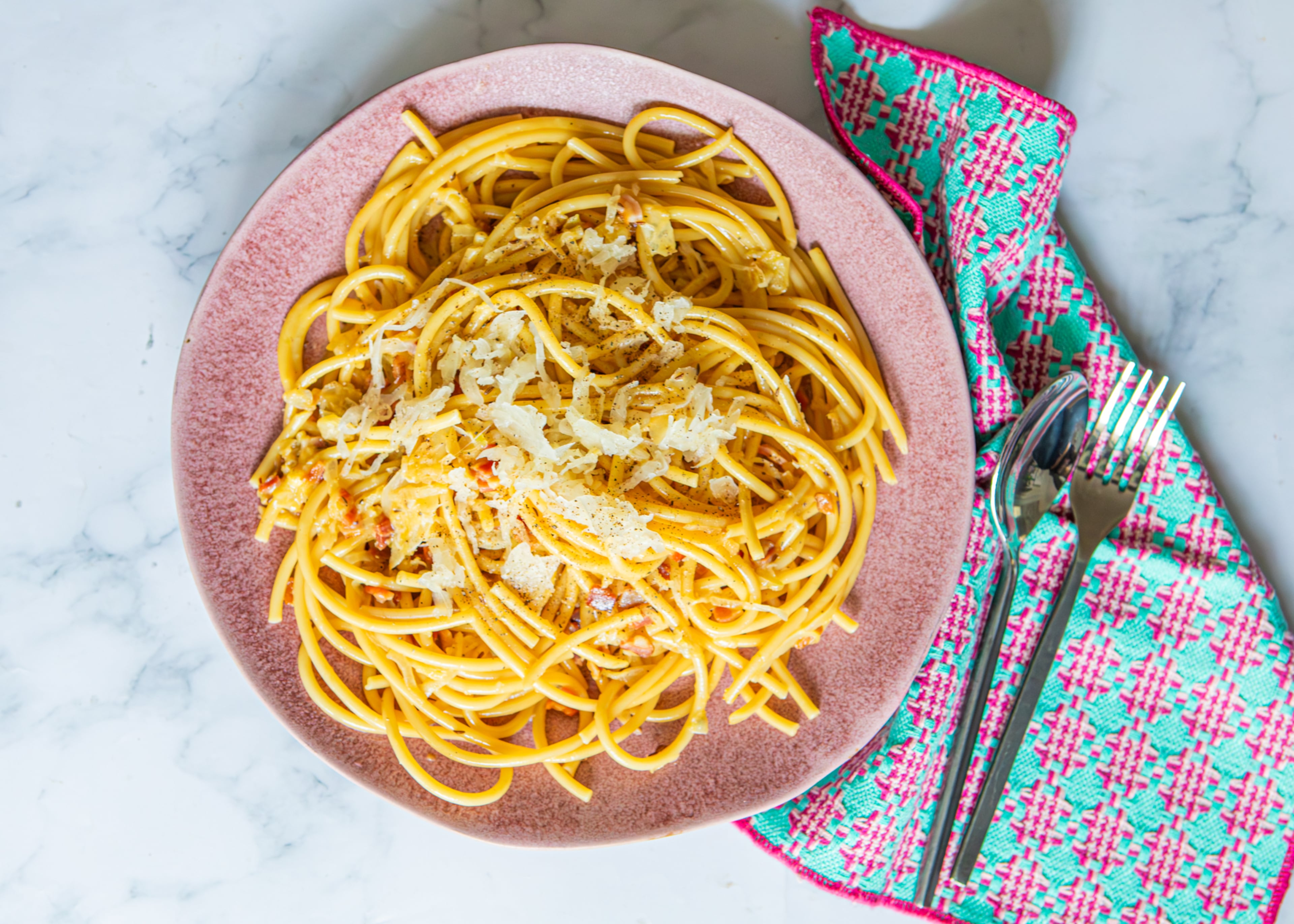 Recipes for both classic and German-Inspired Carbonara (shown here) come together quickly and deliciously. (Aaliyah Man for the AJC/food styling by Kate Williams)