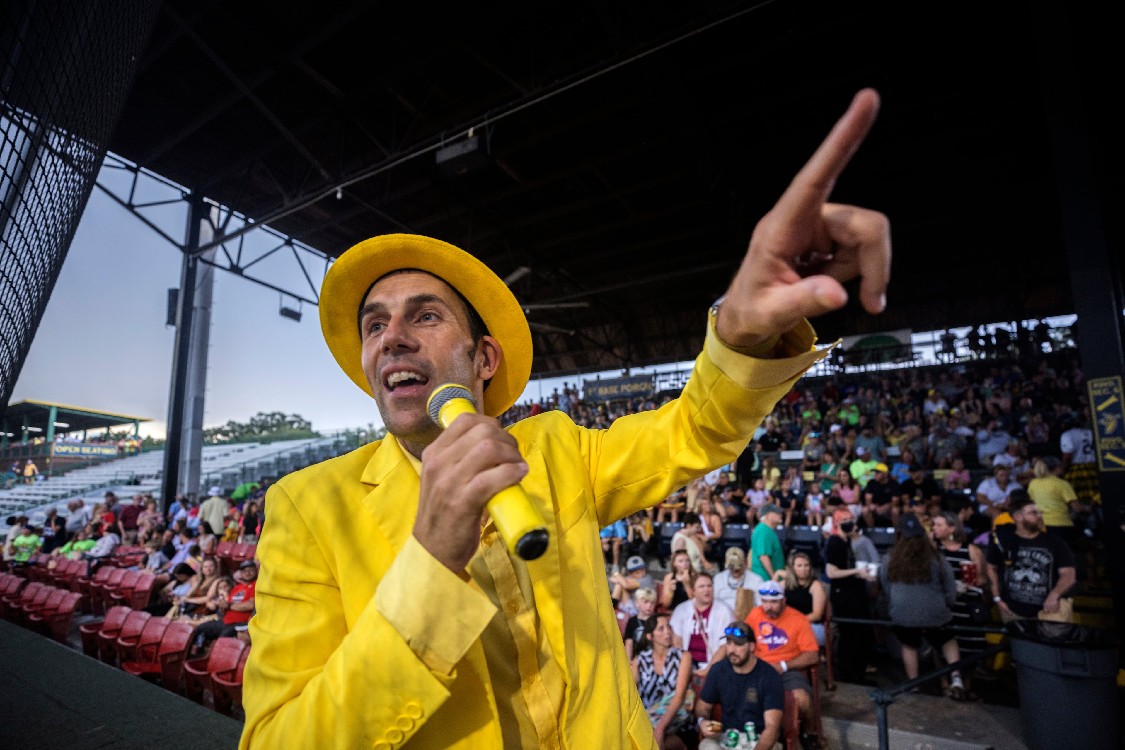 Savannah Bananas owner Jesse Cole, center, looks for contestants during a performance before the start of a home game at Historic Grayson Stadium. (Stephen B. Morton for the AJC)