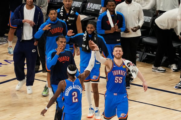 Oklahoma City Thunder center Isaiah Hartenstein (55) celebrates with guard Shai Gilgeous-Alexander (2) during the second half in Game 4 of an NBA basketball first-round playoff series against the Memphis Grizzlies, Saturday, April 26, 2025, in Memphis, Tenn. (AP Photo/George Walker IV)