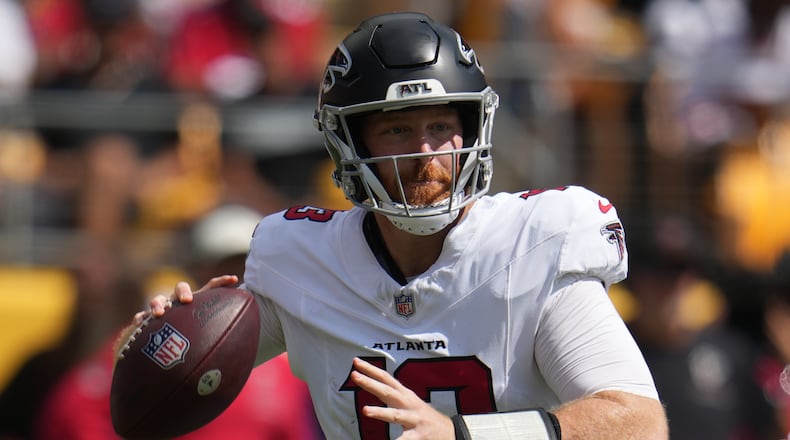 Atlanta Falcons quarterback Cooper Rush (13) looks to pass the ball during an NFL football game against the against the Pittsburgh Steelers, Sunday, Sept. 13, 2026, in Pittsburgh. (AP Photo/Gene J. Puskar)