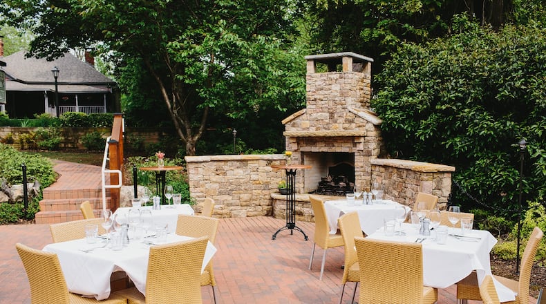 In historic Roswell, Table & Main offers a brick-paved garden patio surrounded by lush greenery, with a stone fireplace to warm up diners in cooler weather. On Wednesday nights, the special is paleo friendly. PHOTO CREDIT: Andrew Thomas Lee