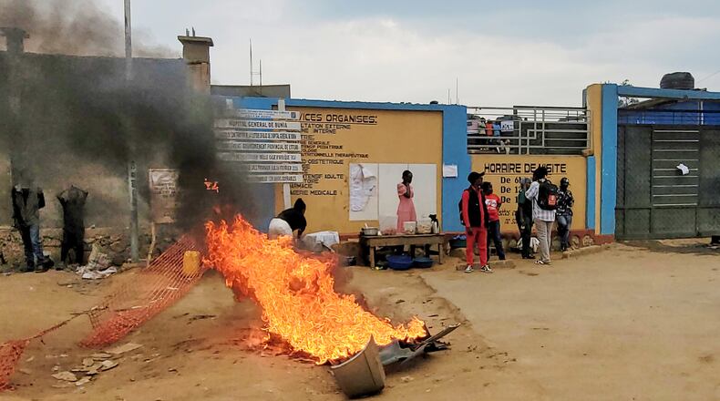 Rubble set on fire as health workers involved in Congo's Ebola response go on strike as they protest over payment issues in Bunia, Congo, Wednesday, July 15, 2026. (AP Photo/Constant Same Bagalwa)