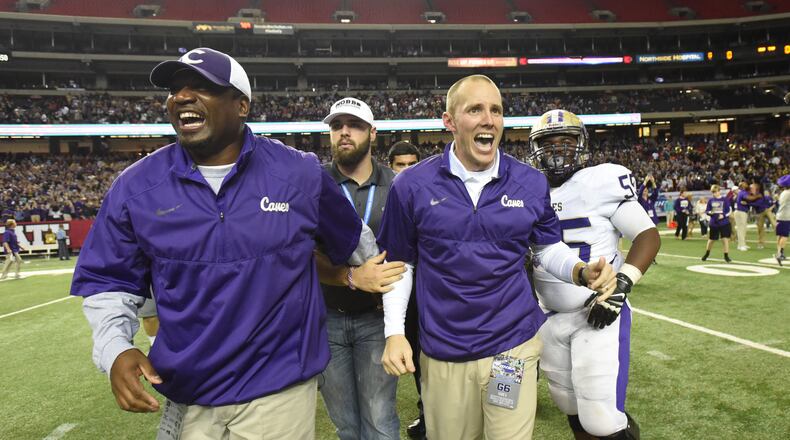 Cartersville head coach Joey King (foreground right) celebrates with other coaching staff during Cartersville's 10-0 win over Buford in the GHSA Class AAAA State Championship at the Georgia Dome on Saturday December 12, 2015. HYOSUB SHIN / HSHIN@AJC.COM