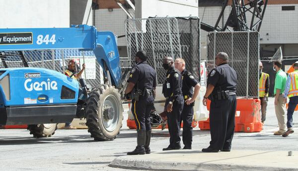 Five workers were injured when a portion of same deck collapsed about noon on Friday. One man was placed on a stretcher and lowered to the ground with a crane.
Steve Schaefer for the Atlanta Journal Constitution
