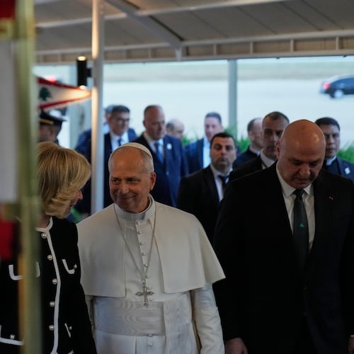 Pope Leo XIV is welcomed by Lebanese President Joseph Aoun, right, and First Lady Nehmat Aoun upon his arrival to Beirut International Airport ,in Beirut, Lebanon, Sunday, Nov. 30, 2025 (AP Photo/Hussein Malla)