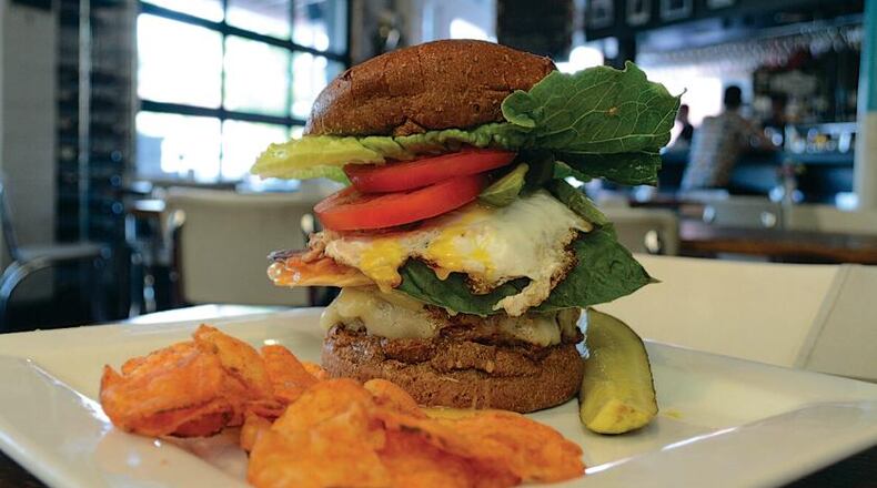 The Local Republic in Lawrenceville serves up craft beer and creative burgers, like "The Sink," which starts with a sunny side up egg, plus whatever else the kitchen wants to add on. Read more about The Local Republic and 24 hours of eating in Gwinnett.(Photo credit: Ben Bailey)