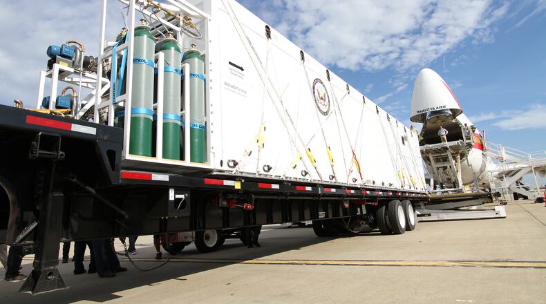 During an exercise earlier this year, a custom-built CBCS container is carried on a special trailer that allows the container to roll onto a device that raises the container to the aircraft’s main cargo floor. Source: Phoenix Air