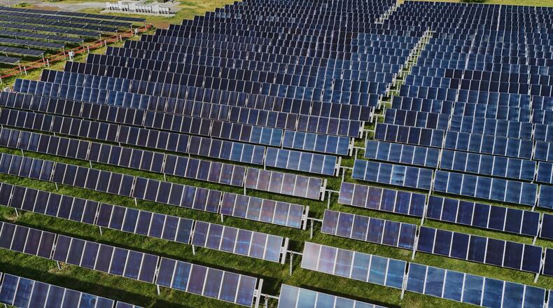FILE - Solar panels operate, April 28, 2026, at a farm in Christiana, Tenn. (AP Photo/Joshua A. Bickel, File)