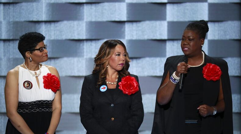 Lucy McBath, center, stands with Geneva Reed-Veal (left) and Sybrina Fulton, the mother of Trayvon Martin,  on day two of the Democratic National Convention in Philadelphia on July 26, 2016. The so-called Mothers of the Movement, who all lost children in violent confrontations with police, vouched for Clinton.  (Eric Thayer/The New York Times)