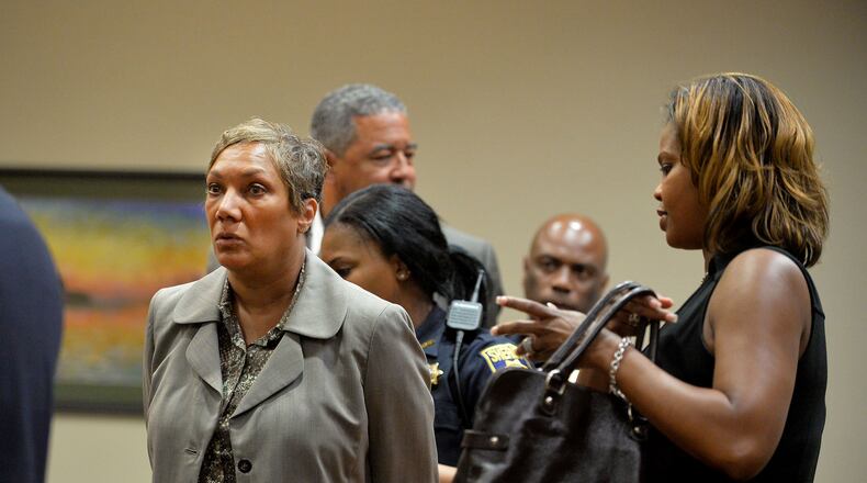 Pat Reid and Tony Pope were returned to custody after DeKalb Superior Court Judge Gregory Adams signed an arrest warrant following a motions hearing May 12. KENT D. JOHNSON /KDJOHNSON@AJC.COM