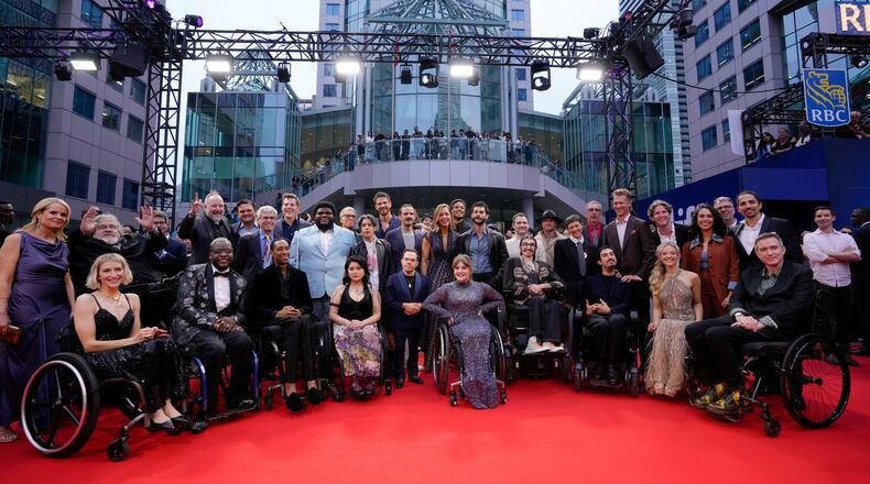 Cast and crew arrive on the red carpet to promote the film Being Heumann at the Toronto International Film Festival, in Toronto, Thursday, Sept. 10, 2026. (Chris Young/The Canadian Press via AP)