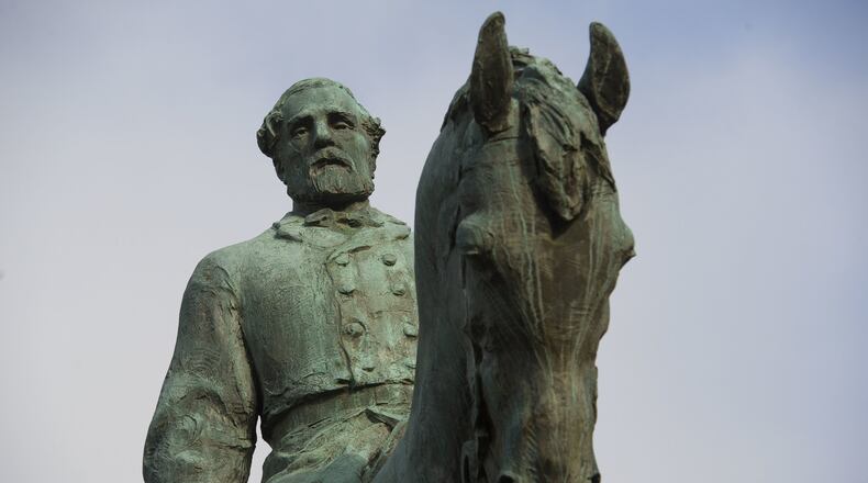 The statue of Confederate Army of Northern Virginia Gen. Robert E. Lee stands in Emancipation Park in Charlottesville, Va., Friday, Aug. 18, 2017. Charlottesville Mayor Mike Signer is expected to make an announcement regarding the Robert E. Lee statue later in the day. (AP Photo/Cliff Owen)