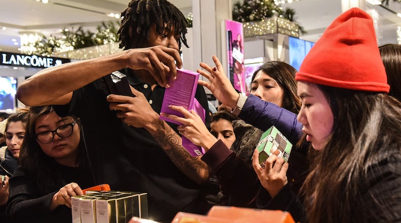 NEW YORK, NY - NOVEMBER 23:  People shop at Macy's department store on "Black Friday" on November 23, 2017 in New York City. Black Friday starts earlier in the season on Thanksgiving Day instead of the Friday after. (Photo by Stephanie Keith/Getty Images)