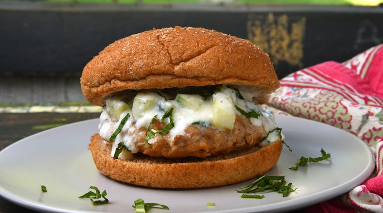 This Chicken Burgers with Tzatziki recipe produces four burgers. (Chris Hunt for The Atlanta Journal-Constitution)