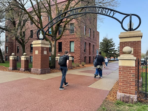 Students walk to class at Dakota State University, Monday, April 28, 2025, in Madison, S.D. (AP Photo/Sarah Raza)