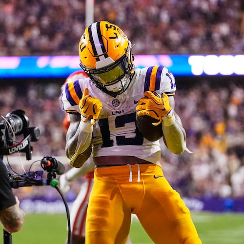 LSU running back Dilin Jones (13) celebrates his touchdown against Clemson in the second half of an NCAA college football game, Saturday, Sept. 5, 2026 in Baton Rouge, La. (AP Photo/Gerald Herbert)