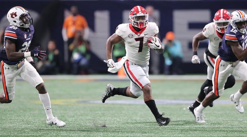 Georgia running back D’Andre Swift breaks away for a long touchdown run against Auburn during the second half of the SEC Football Championship at Mercedes-Benz Stadium, December 2, 2017, in Atlanta. Curtis Compton / ccompton@ajc.com