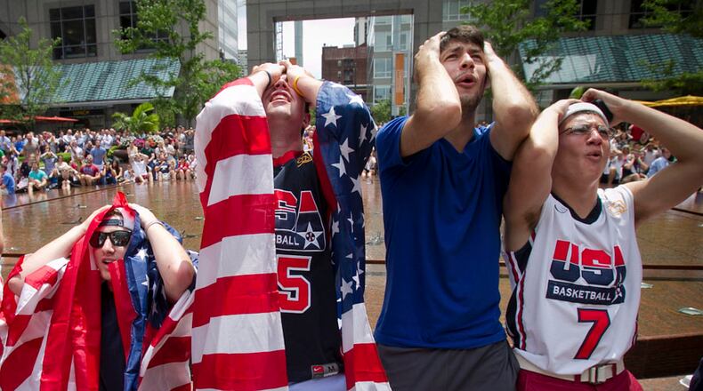 U.S.A soccer fans, from left, Zach Levy, Aaron Rawdin, Blake Friedman, Giacomo Presta , from Abingdon, Pa., and Jake Ritter, from Huntington Valley, Pa., grimace after a missed attempt at goal during the last couple minutes of play as they watch the World Cup at Commerce Plaza, in Philadelphia Thursday June 26, 2014. Germany defeated the U.S. 1-0. ( AP Photo / The Philadelphia Daily News, Alejandro A. Alvarez ) THE EVENING BULLETIN OUT, TV OUT; MAGS OUT; NO SALES