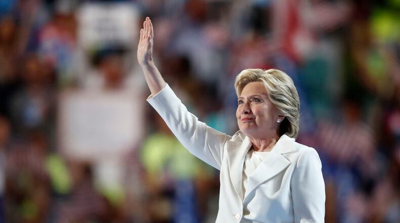 Democratic presidential nominee Hillary Clinton waves after taking the stage during the final day of the Democratic National Convention in Philadelphia , Thursday, July 28, 2016. (AP Photo/Paul Sancya)