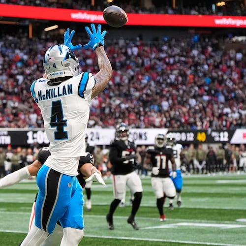 Carolina Panthers wide receiver Tetairoa McMillan (4) pulls in a touchdown pass against the Atlanta Falcons in the second half of an NFL football game, Sunday, Nov. 16, 2025, in Atlanta. (AP Photo/Brynn Anderson)