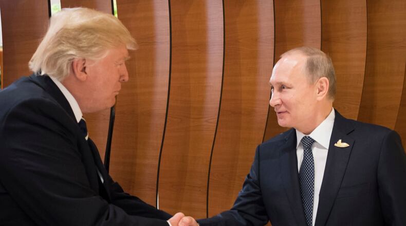 President Donald Trump met with Russian President Vladimir Putin (right) earlier this month at the G20 summit.