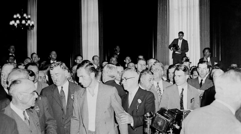 FILE - Bruno Richard Hauptmann being takent to his cell after being arraigned in New York on Sept. 27, 1934. (AP Photo, File)
