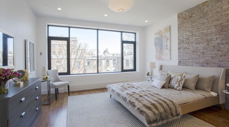 Incorporating coziness is key to creating a sense of hygge. One way to do this is through the use of soft, cozy elements such as toss pillows, rugs and throws. (Design Recipes)