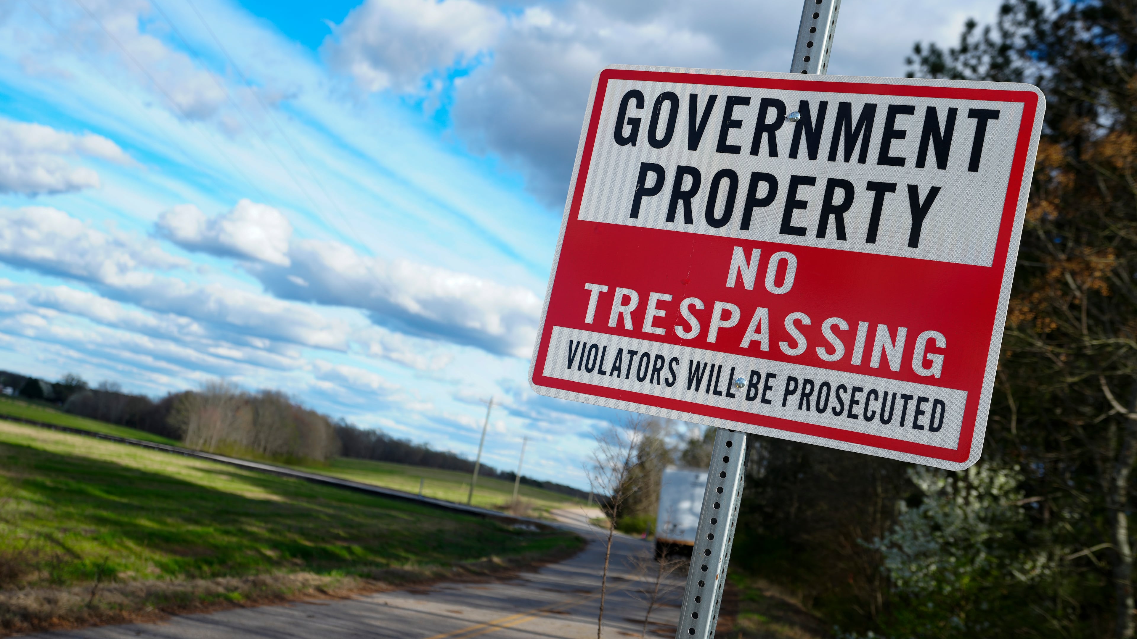 FILE - A sign warns against trespassing on government property at the site of a planned Rivian electric truck plant March 7, 2024, in Rutledge, Ga. (AP Photo/John Bazemore, File)