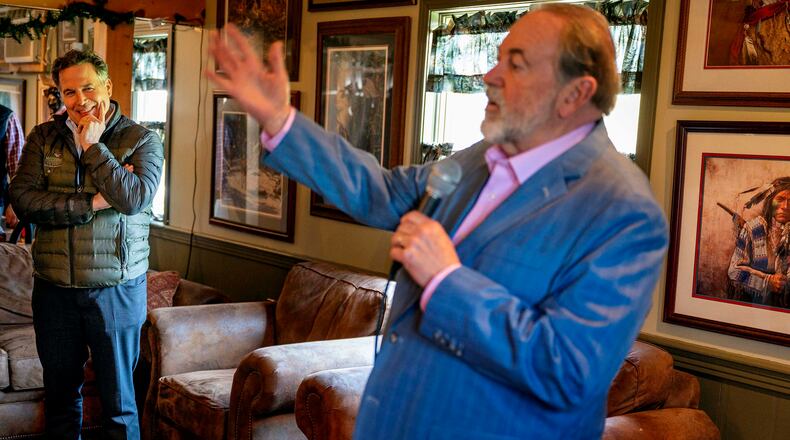 Former Arkansas Gov. Mike Huckabee, right, and Pennsylvania Republican candidate for Senate David McCormick attend the Wallenpaupack Sportsman’s Association’s annual ice fishing party. (Tom Gralish/The Philadelphia Inquirer/TNS)