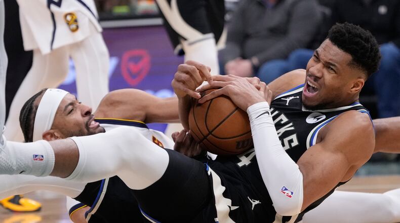 Milwaukee Bucks' Giannis Antetokounmposaid he expects to miss four to six weeks after he suffered a second injury to his right calf Friday night. (Morry Gash/AP)