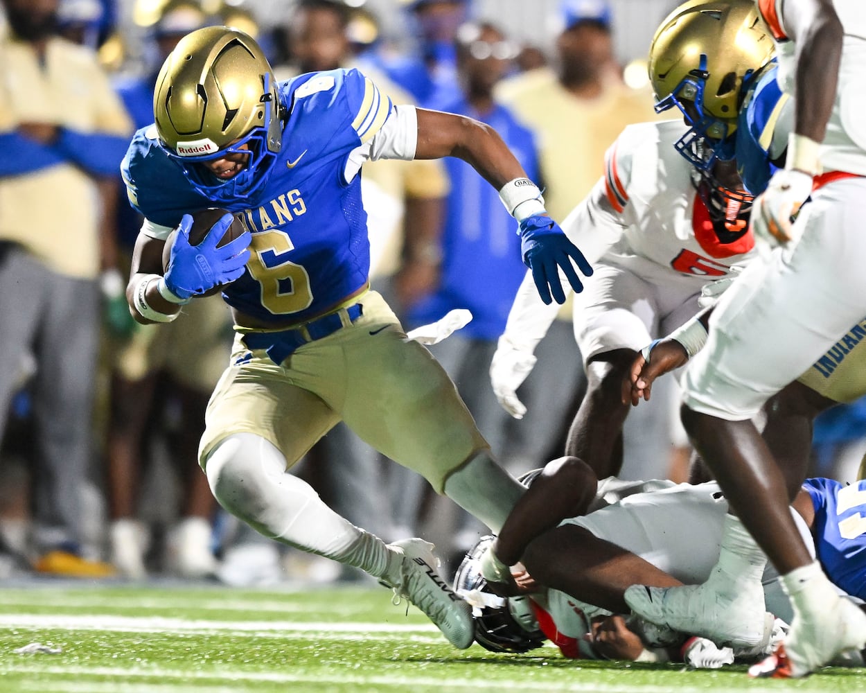 McEachern’s Casey Barner (6) breaks through North Cobb’s defense during the second half of play Friday, August 22, 2025 at McEachern.  (Daniel Varnado/For the Atlanta Journal-Constitution)