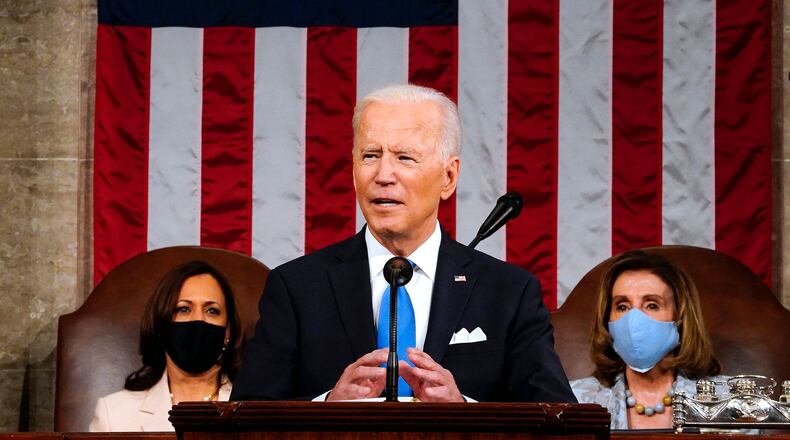 President Joe Biden, flanked by Vice President Kamala Harris, left, and Speaker of the House of Representatives Nancy Pelosi addresses a joint session of Congress at the U.S. Capitol in Washington, D.C., on Wednesday, April 28, 2021. (Melina Mara/POOL/AFP via Getty Images/TNS)