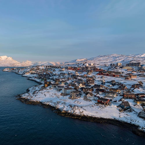 FILE - Houses are seen near the coast of a sea inlet of Nuuk, Greenland, on Sunday, Jan. 25, 2026. (AP Photo/Evgeniy Maloletka, File)