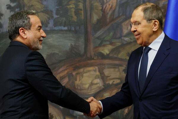 Iranian Foreign Minister Abbas Araghchi, left, and Russian Foreign Minister Sergey Lavrov shake hands after a news conference following their meeting in Moscow, Russia, Friday, April 18, 2025. (Tatyana Makeyeva/Pool Photo via AP)