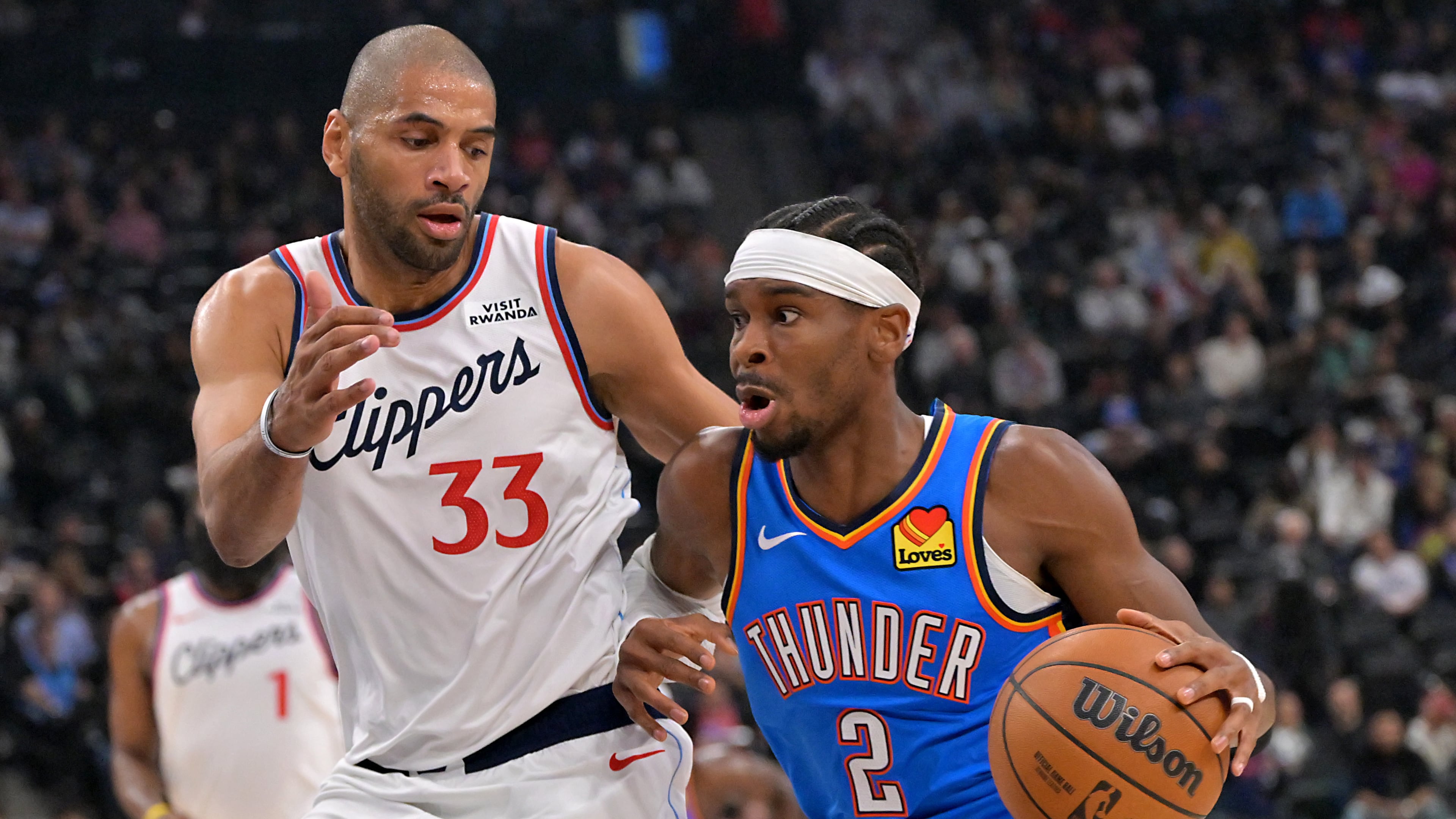 Oklahoma City Thunder guard Shai Gilgeous-Alexander drives past Los Angeles Clippers forward Nicolas Batum during the first half of an NBA basketball game Tuesday, Nov. 4, 2025, in Los Angeles. (AP Photo/Jayne Kamin-Oncea)