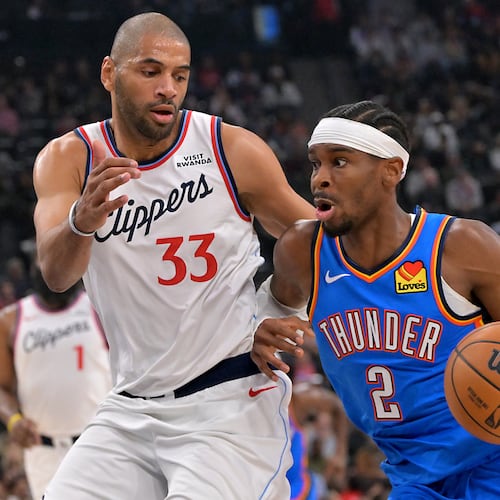 Oklahoma City Thunder guard Shai Gilgeous-Alexander drives past Los Angeles Clippers forward Nicolas Batum during the first half of an NBA basketball game Tuesday, Nov. 4, 2025, in Los Angeles. (AP Photo/Jayne Kamin-Oncea)