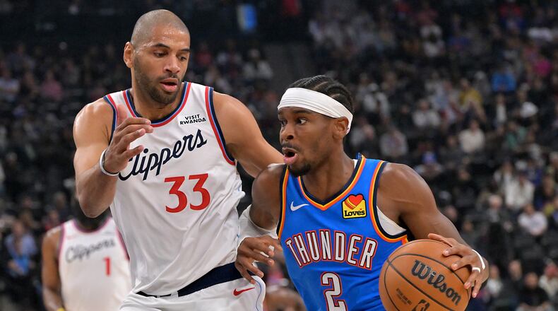 Oklahoma City Thunder guard Shai Gilgeous-Alexander drives past Los Angeles Clippers forward Nicolas Batum during the first half of an NBA basketball game Tuesday, Nov. 4, 2025, in Los Angeles. (AP Photo/Jayne Kamin-Oncea)