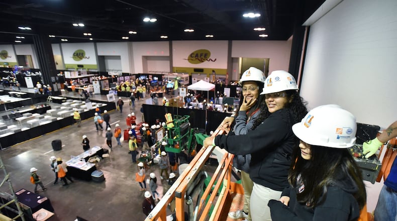 Students from Ridgeview Charter School in Sandy Springs ride on a scissor lift provided by McKenney’s Inc. during 2019 CEFGA CareerExpo at Georgia International Convention Center on March 21. Getting students career ready has taken on momentum in recent years — so much so that schools are starting as early as elementary school exposing kids to fields such as construction trades.