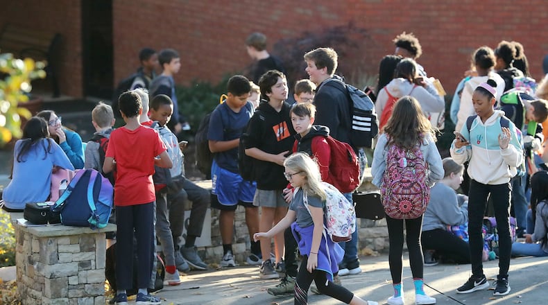 In this file photo, school gets out at Mabry Middle School in Cobb County where an unvaccinated was diagnosed with measles. Curtis Compton/ccompton@ajc.com